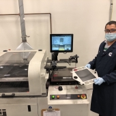 A Cummins employee works on the cathode screen printing process, towards the end of the solid oxide fuel cell manufacturing line at the company's facility in Malta, New York (U.S.).